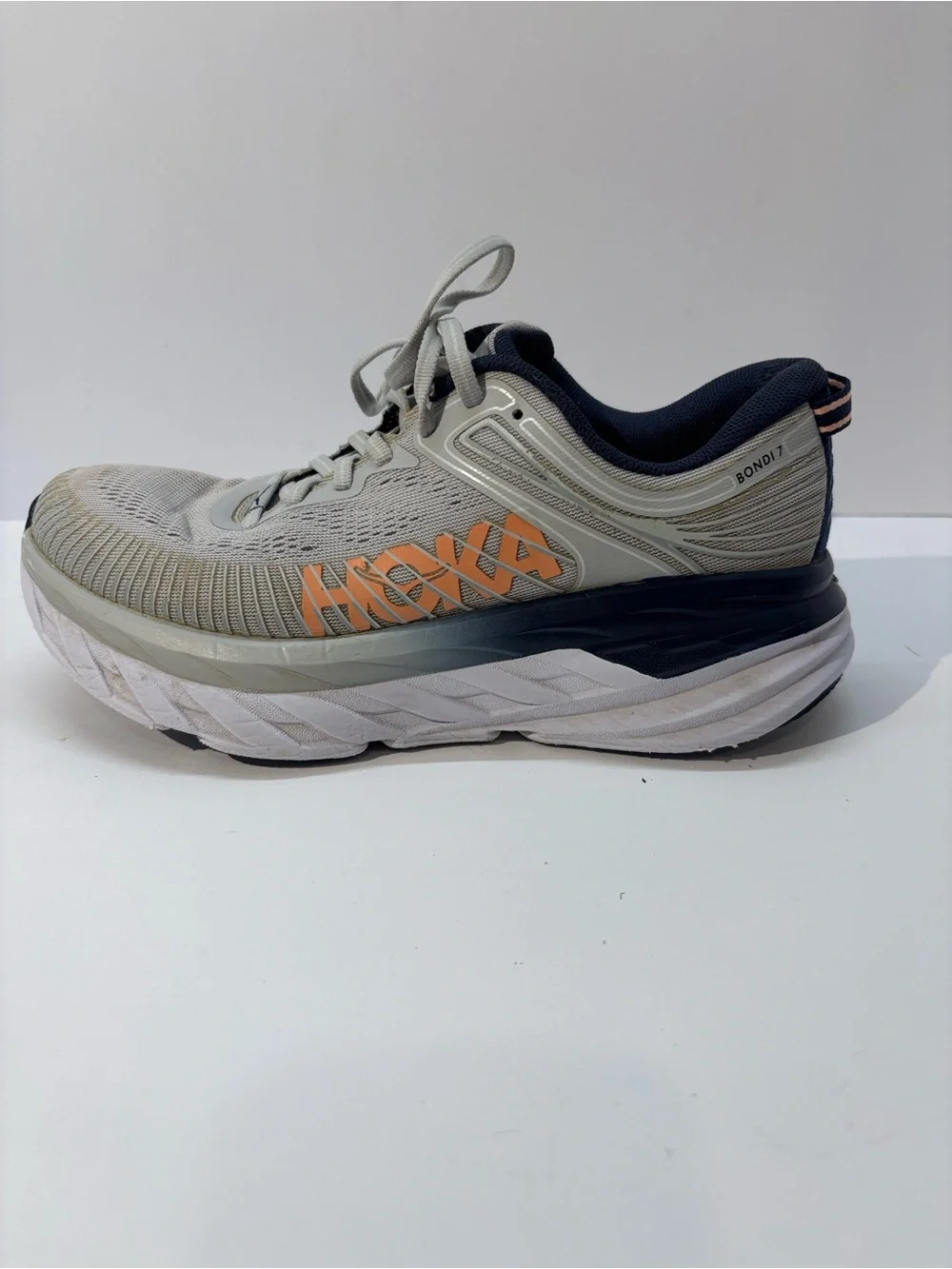 Hoka women’s size 7 gray/peach Bindi 7 style #110531 LRBI in fair condition.